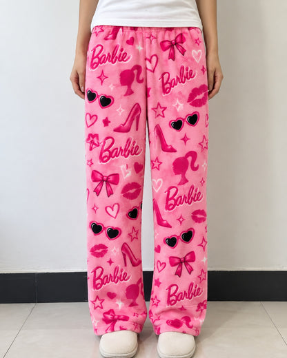 Pink Barbie print fleece lounge pants worn