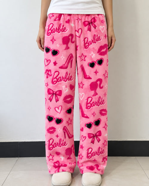 Pink Barbie print fleece lounge pants worn
