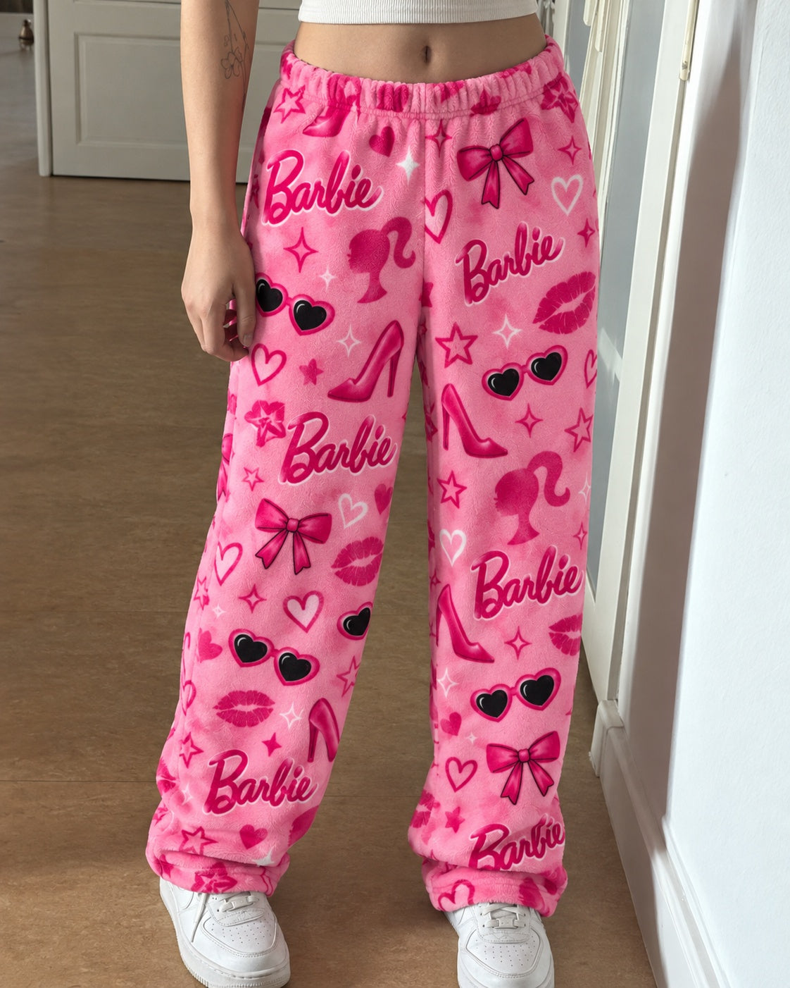 Pink Barbie lounge pants with sneakers